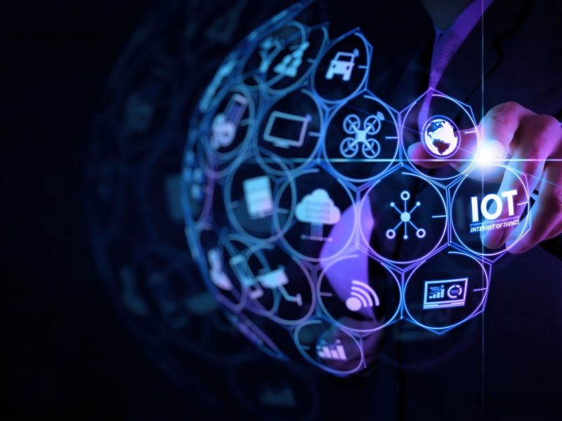 Digital transformation,IOT Internet of things Digital transformation Modern Technology concept businessman select the abstract chip with text IoT on the virtual display on virtual screen.