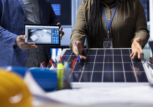 Photovoltaics factory investors evaluate solar panels, addressing issues Photovoltaics factory investors evaluating solar panel structure design, addressing technical considerations and innovations for advancing clean energy technology, close up shot